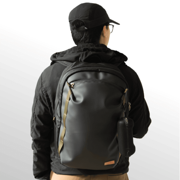 A person carrying OTG Grid Backpack